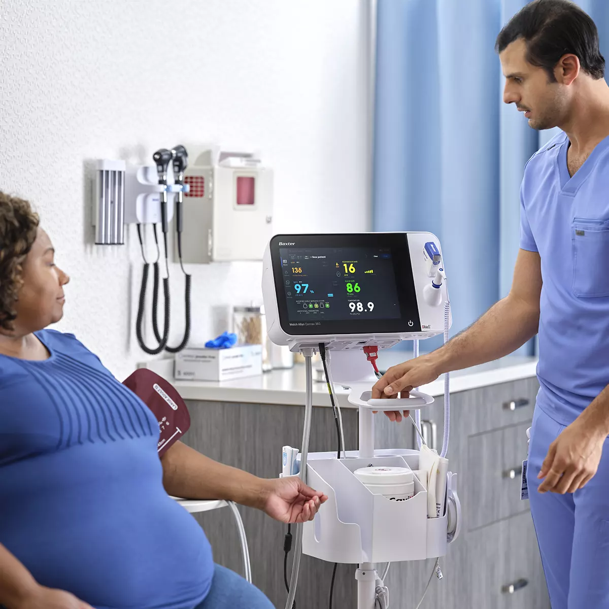 A study coordinator recording a participant's vitals during a clinical trial visit